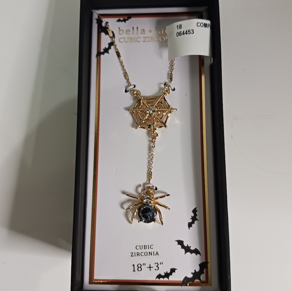 Gold necklace with spiderweb and spider pendants.